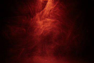 Abstract red swirling smoke patterns on a dark background, creating a fiery, ethereal, and intense...