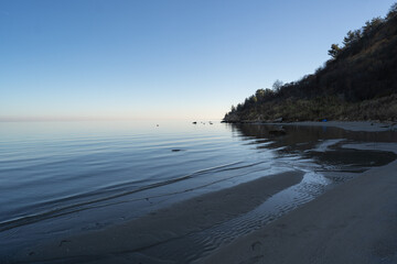 Empty beach of Nea Agathoupoli in Greece during sunset
