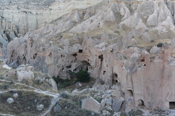 Rock Formations with ancient human made caves in Cappadocia, Anatolia, Turkey