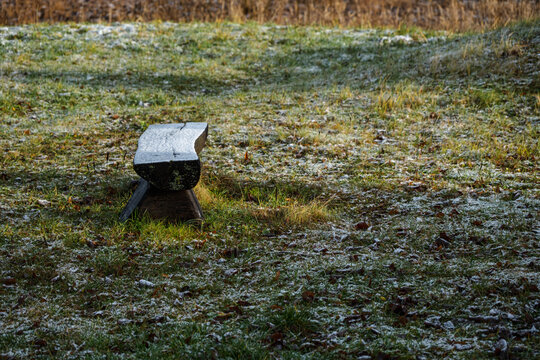 hand made wooden bench in meadow grass