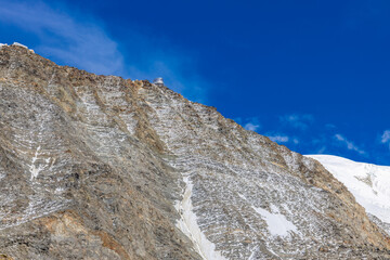 Snow mountain summits and white ice glacier in the Alps. Mont Blanc climbing route and views from ascent on Montblanc. Classic Gouter route to the highest mountain in Europe, France
