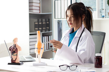 female doctor looking at x ray