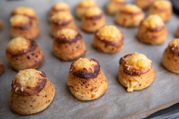 Pogaca stuffed with cheese. A full tray of fresh Pogaca traditional Eastern European salty buns with cheese - Pogace.