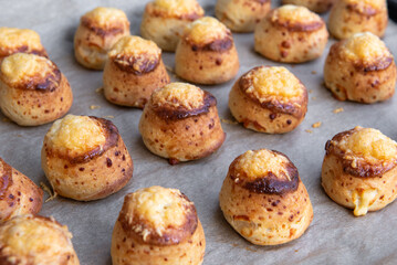 Pogaca stuffed with cheese. A full tray of fresh Pogaca traditional Eastern European salty buns with cheese - Pogace.