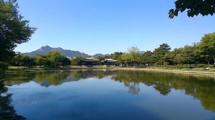Obraz premium Serene Korean Landscape Featuring Calm Pond and Traditional Pavilions