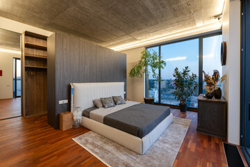A Modern Minimalist Bedroom Design Featuring a Stunning Panoramic View and Natural Elements