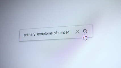 A search bar with the entering query Primary symptoms of cancer