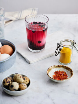 A glass with a staining solution and an egg in it, close-up