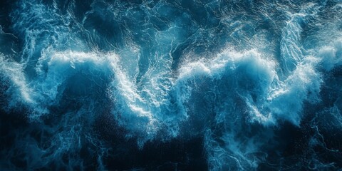 Obraz premium Dramatic ocean waves captured in motion with a deep blue hue