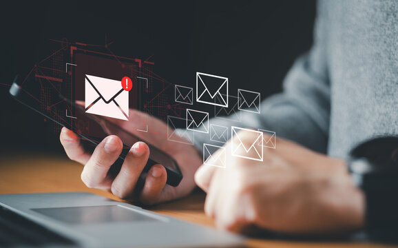 Business man using smartphone and computer that show warning sign after got attack phishing email by malware from hacker that commit cyber crime or software crash to cause an error. - Powered by Adobe