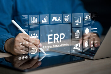 Enterprise resource planning concept. Businessman using tablet and laptop for business management...
