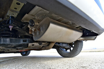 Muffler on the lower part of the car