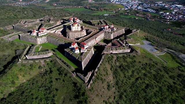 Portugal travel and landmarks, Alentejo region. medieval military fortification Nossa Senhora in Elvas. unique star-shaped  architecture. UNESCO heritage site, aerial drone 4k hd footage