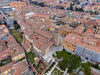 Selbstklebende Fototapeten Aerial view of Rieti's historic old town in Italy, with the cathedral Santa Maria Assunta standing prominently in the center. Narrow medieval streets and terracotta rooftops surround the cathedral © Salvati Photography