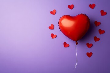 A heart-shaped balloon and small red paper hearts on a purple background