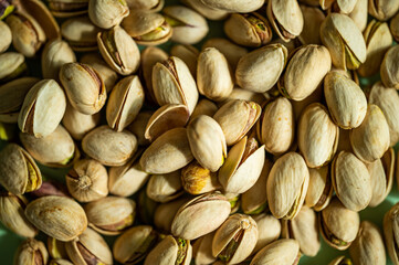 Pistachio nuts. Many pistachios in a pile.