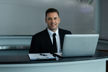 Confident Receptionist at a Modern Venue