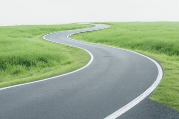 Obraz premium Empty winding road curves through green grassy field. Smooth asphalt pathway leads into horizon. Serene landscape in daylight. Rural scenery evokes sense of travel, exploration. Tranquil, peaceful