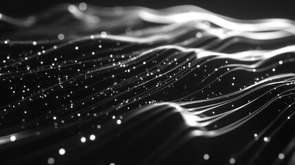 Abstract grayscale image of wavy lines and particles.  Dark background with light streaks and specks.