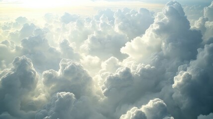 a view from above of fluffy clouds against a blue sky