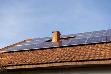Solar panels installed on a roof enhance energy efficiency in a sunny neighborhood