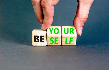 Motivational be yourself symbol. Concept words Be yourself on beautiful wooden block. Beautiful grey background Businessman hand. Business motivational be yourself concept. Copy space.