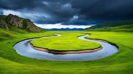 Obraz premium Serene River Meandering Through Lush Green Landscape Under Clouds