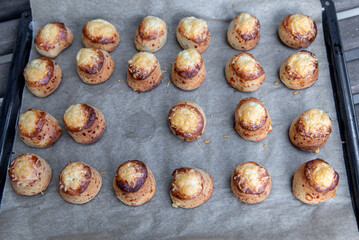 Pogaca stuffed with cheese. A full tray of fresh Pogaca, salty buns with cheese - Pogace.