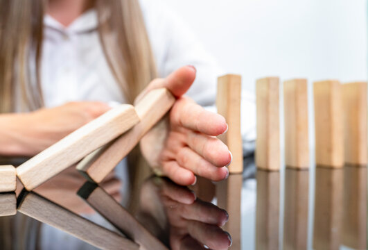 Midsection Of Businesswoman Holding Toy Block
