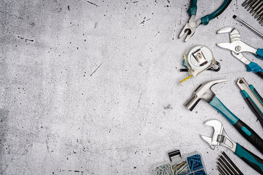 Set of tools on concrete background, - Powered by Adobe