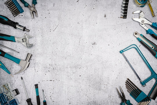 Set of tools on concrete background,