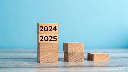 2025 Happy New Year. Wooden cube block change from 2024 to 2025 on blue. Concept 2025 New Year background. Business, resolutions, goals, inspiration, success, ideas