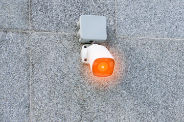 outdoor surveillance camera on concrete wall