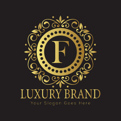 Letter Luxury brand logo design with a royal gold crown emblem and elegant typography
