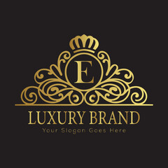 Letter Luxury brand logo design with a royal gold crown emblem and elegant typography
