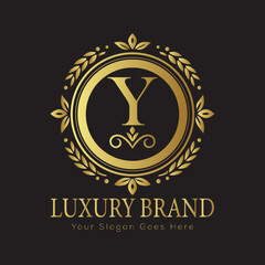Letter Luxury brand logo design with a royal gold crown emblem and elegant typography
