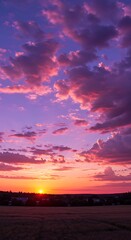 Obraz premium Purple sky background with clouds at sunset on a summer evening 