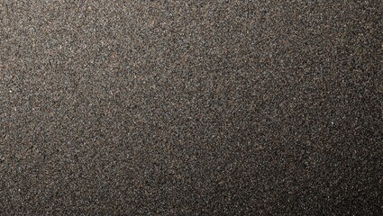 High quality sandpaper texture with various grit sizes from dark gray to light brown shimmering under light