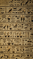 Egyptian hieroglyphs and paintings on the walls of Egyptian ancient temples