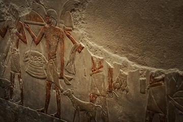 Egyptian hieroglyphs and paintings on the walls of Egyptian ancient temples