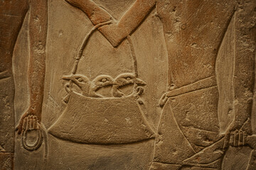 Egyptian hieroglyphs and paintings on the walls of Egyptian ancient temples