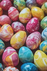 Obraz premium Bunch of colorful eggs with swirls and patterns on them. The eggs are arranged in a pile, with some overlapping and others standing upright