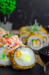 Composition of assorted sushi boards for dinner