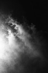Fototapeta premium white smoke against a black background with soft diffused lighting