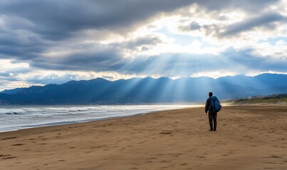 Lone hiker beach sunset mountains hope