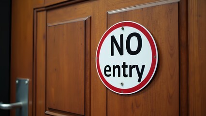 A red white sign with no entry word written on the wooden door of the building to prevent people from entering, close-up photograph