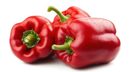 three red bell peppers on a white background