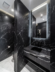 Black marble toilet. Private house.