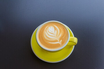 Cup of hot cappuccino coffee on a table