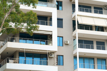 Modern minimalist apartment building in Mediterranean style with air conditioning in Albania on the sea coast. Concept of selling a house abroad, renting apartments